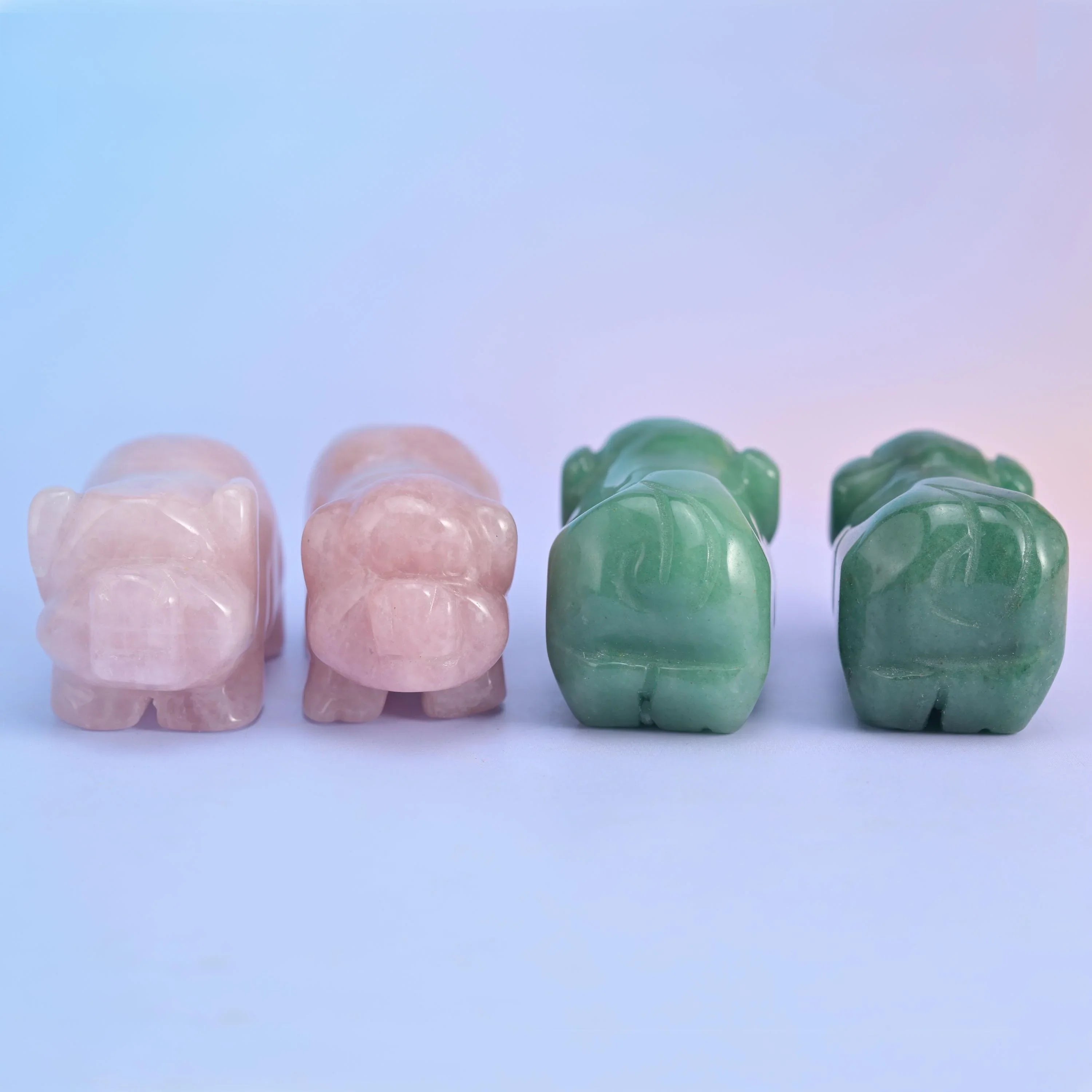 Rose Quartz pig figurine in soft blush pink tones.