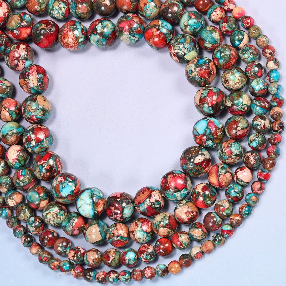 Red sea sediment jasper round beads coiled into a wide open ring with a large open center.