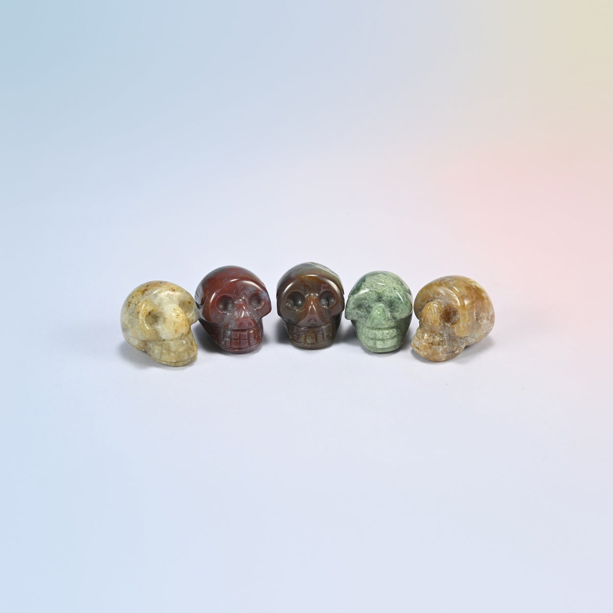 1 inch skull crystal carving in Indian agate, brown and cream banded natural stone
