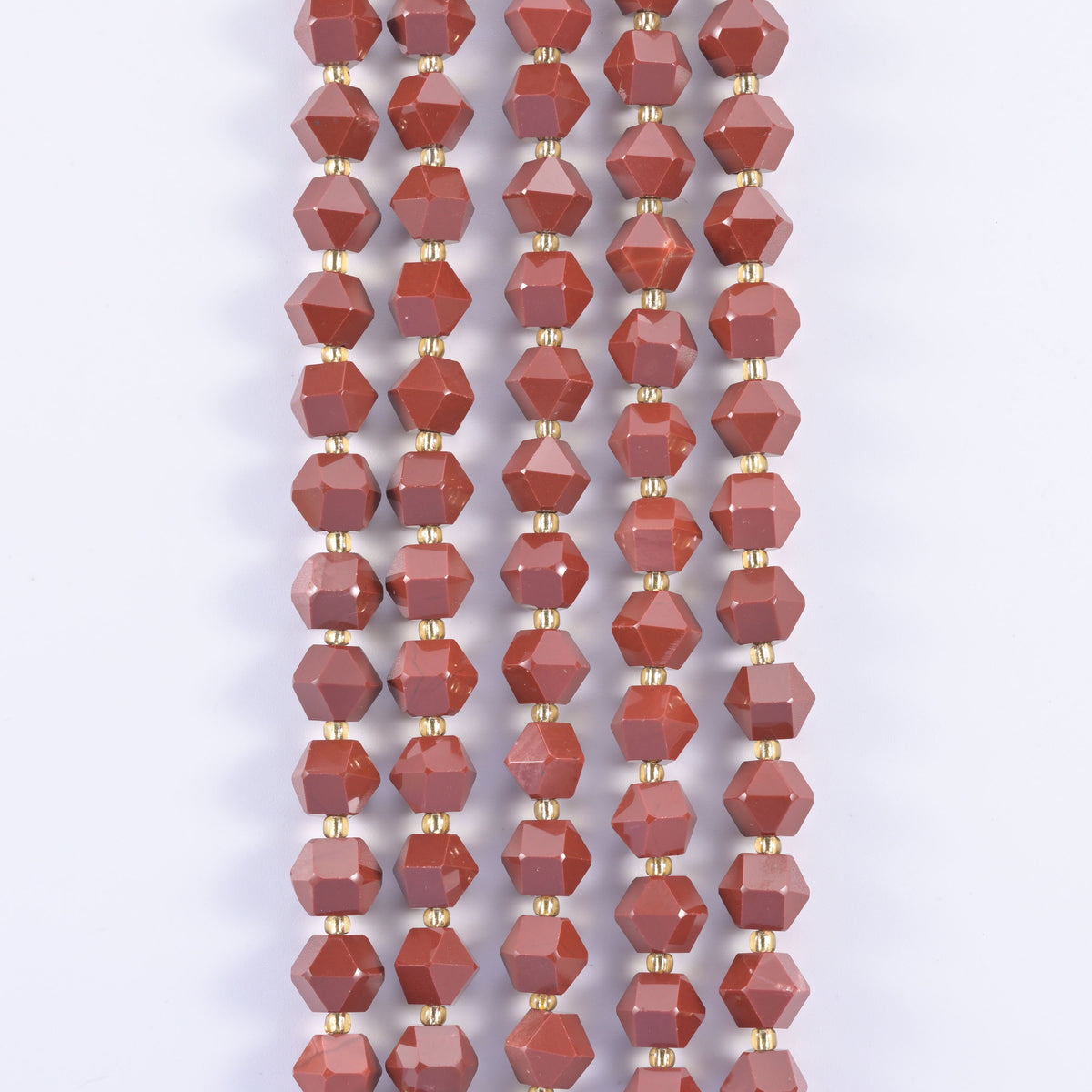 Faceted eight-sided gemstone beads, mottled green and speckled colourways offered.