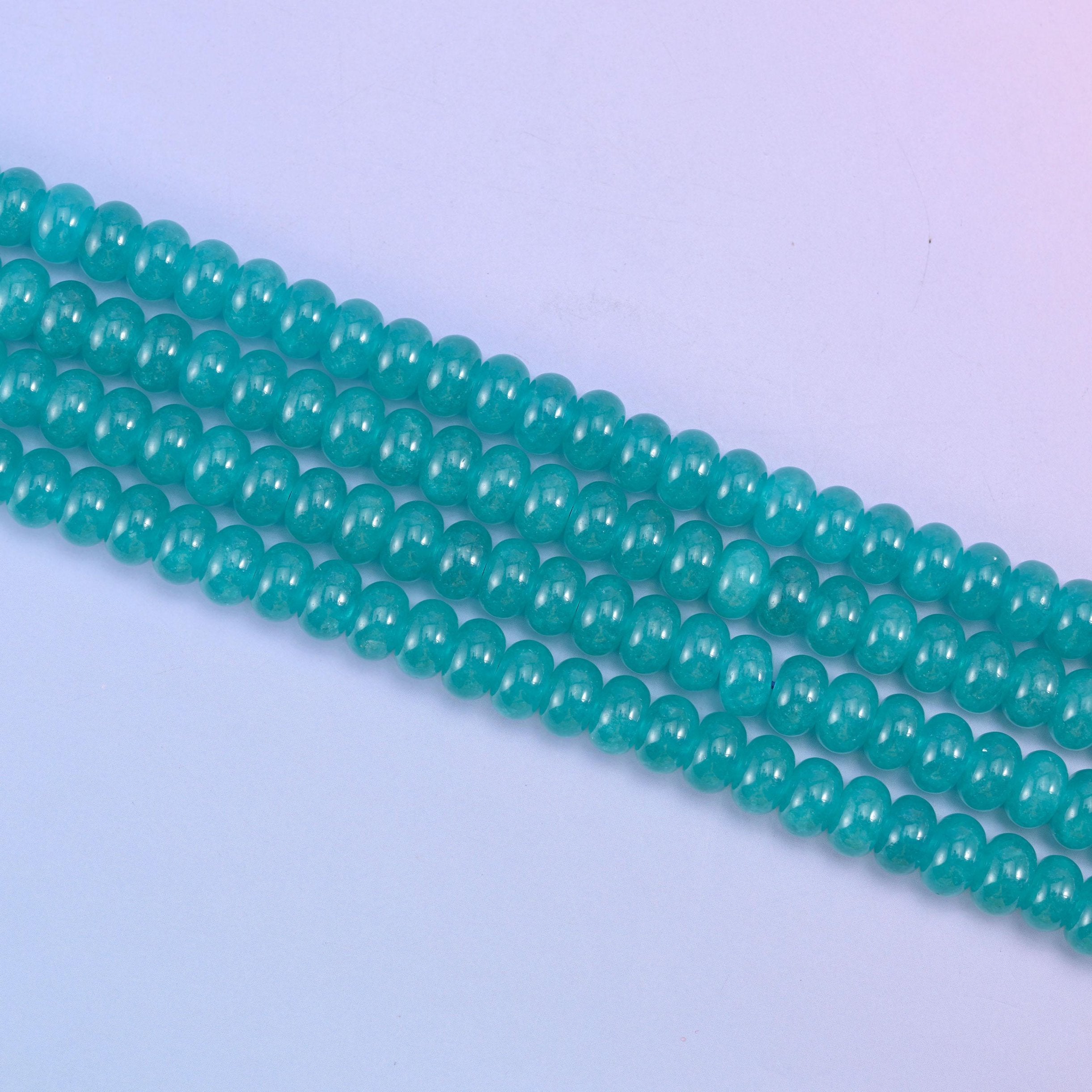 Teal Dyed Jade beads in a rich aqua-teal tone