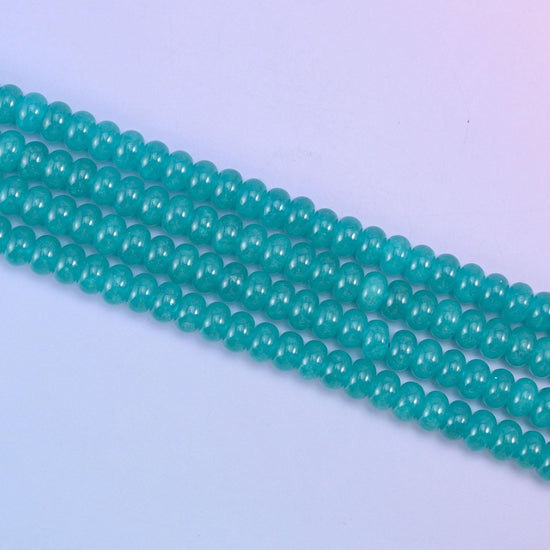 Teal Dyed Jade beads in a rich aqua-teal tone