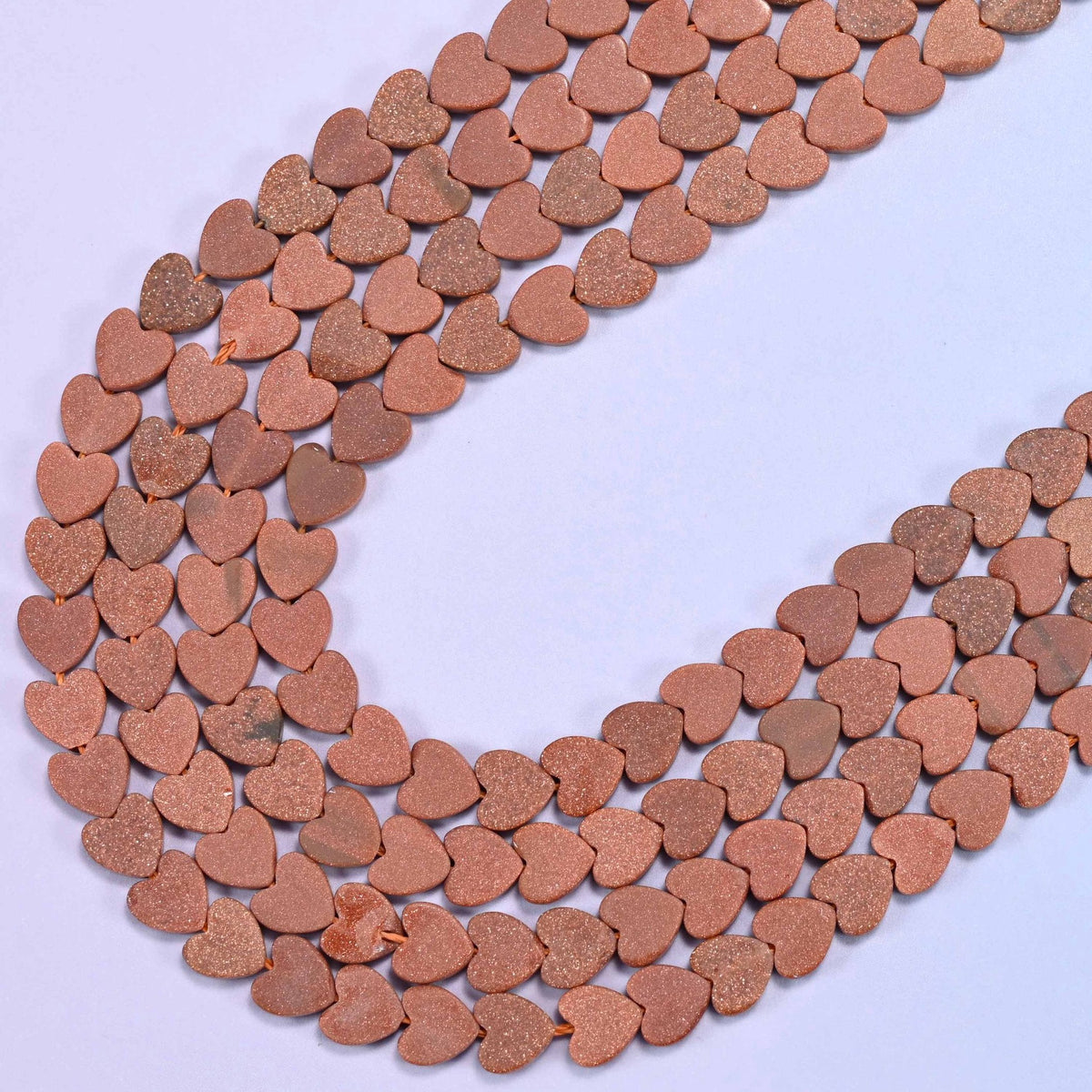 Matte gold sandstone flat heart beads, 15 inch strand