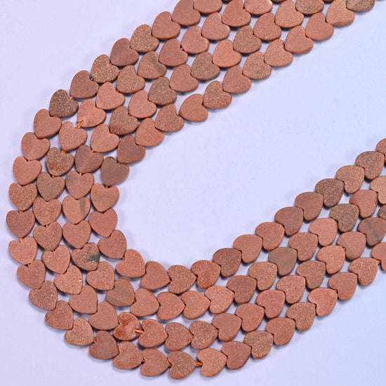 Matte gold sandstone flat heart beads, 15 inch strand