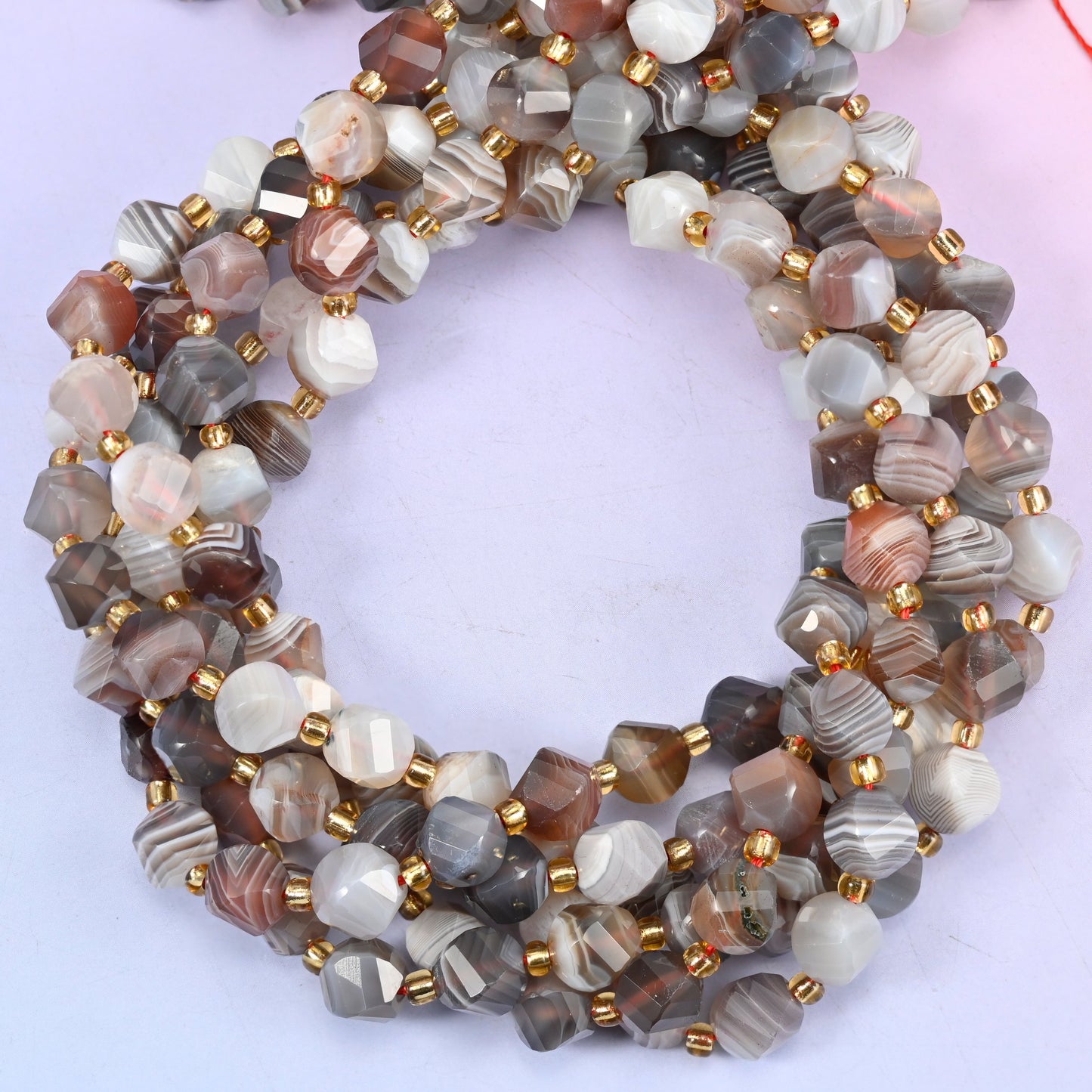 Botswana agate natural stone beads, 8mm faceted spiral twist, each bead carrying its own banding pattern
