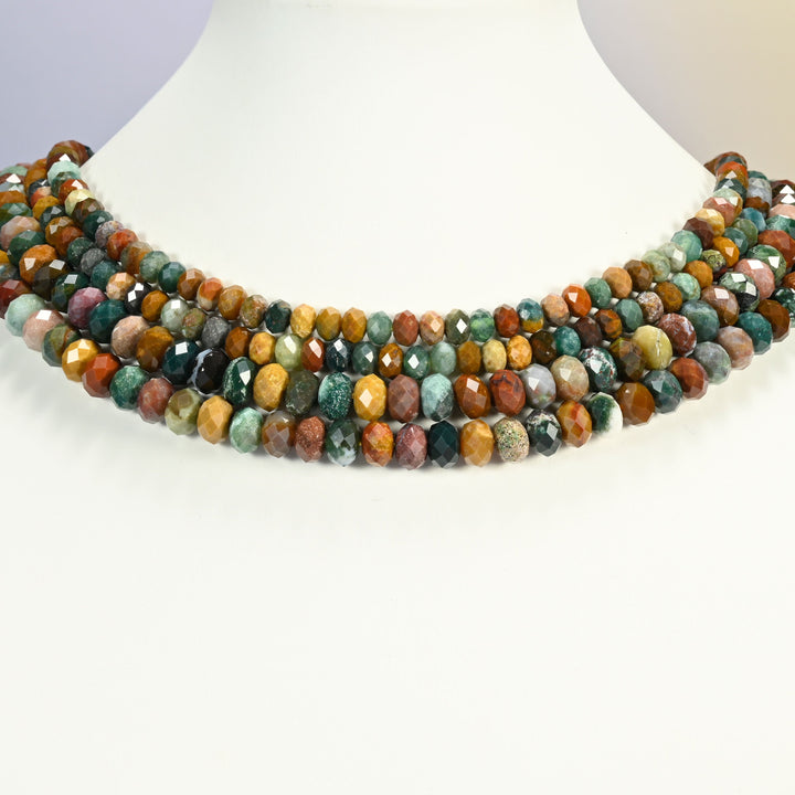 Ocean Agate faceted rondelle beads shown on a white neck display, several 15 inch strands sitting together like a collar at 4x6mm and 5x8mm.