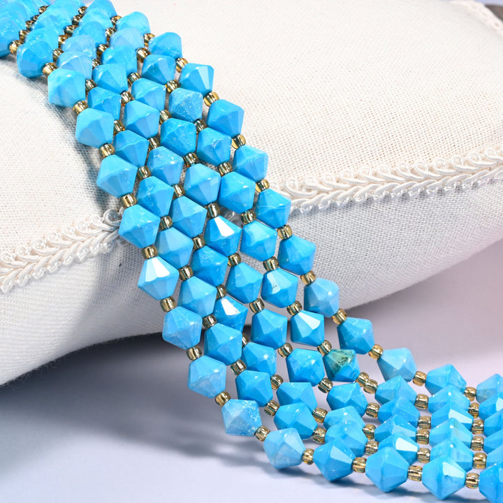 Dyed blue howlite faceted bicone beads over a white cushion, bright blue with gold seed spacers.