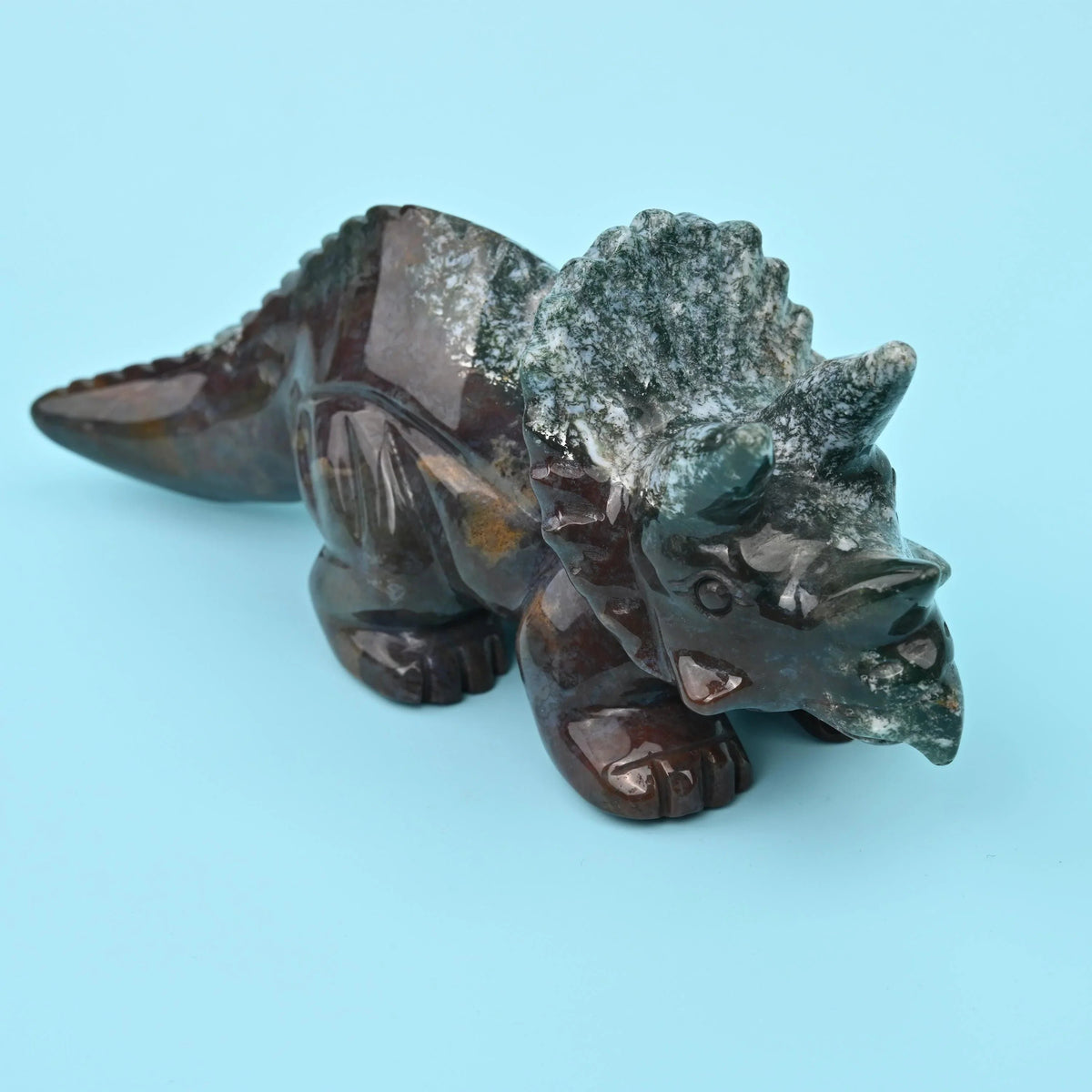 Agate dinosaur carving, Triceratops figurine, 8 inches long.