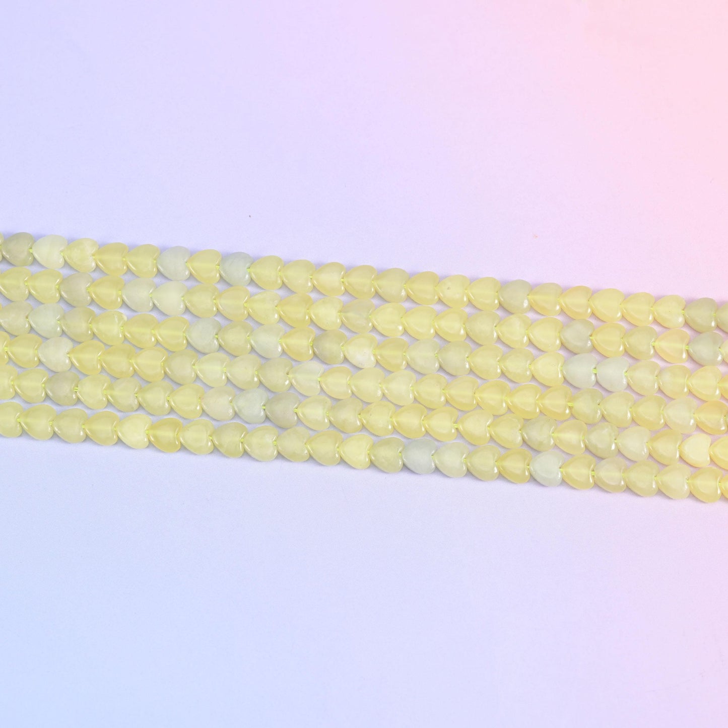 Lemon jade heart beads in soft buttery yellow