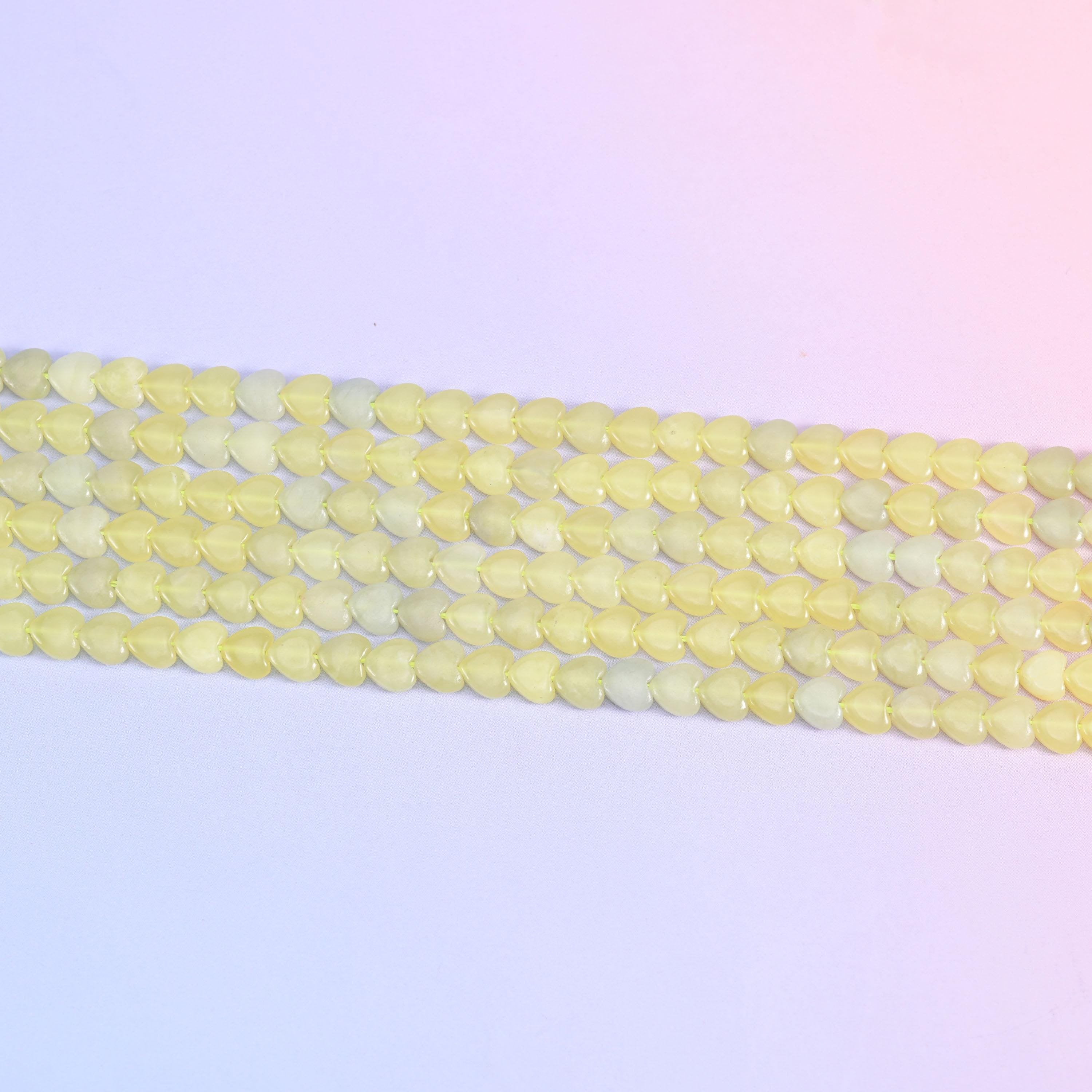 Lemon jade heart beads in soft buttery yellow