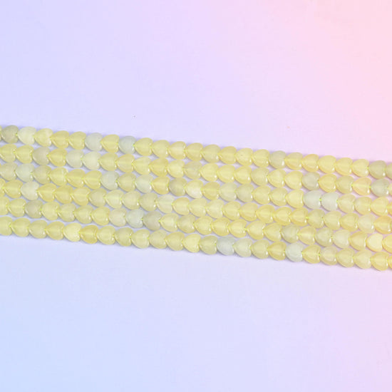 Lemon jade heart beads in soft buttery yellow
