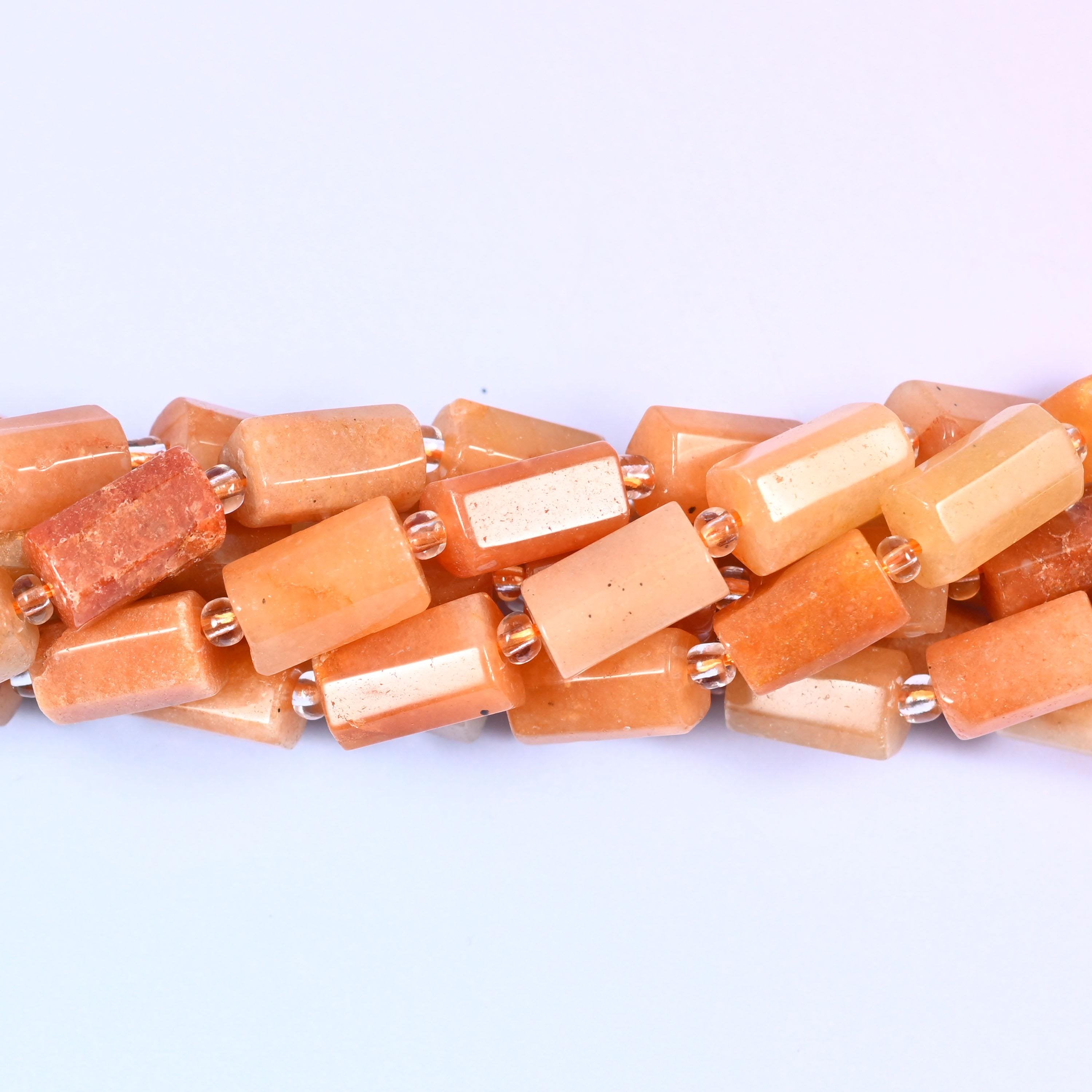 Natural Red Aventurine faceted tube cylinder beads with a sleek, modern shape and a rich red-brown color