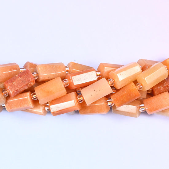 Natural Red Aventurine faceted tube cylinder beads with a sleek, modern shape and a rich red-brown color