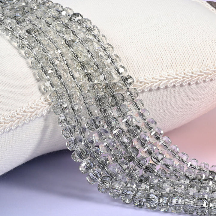 Transparent black faceted rondelle glass beads, smoke-tinted and charcoal in the mass