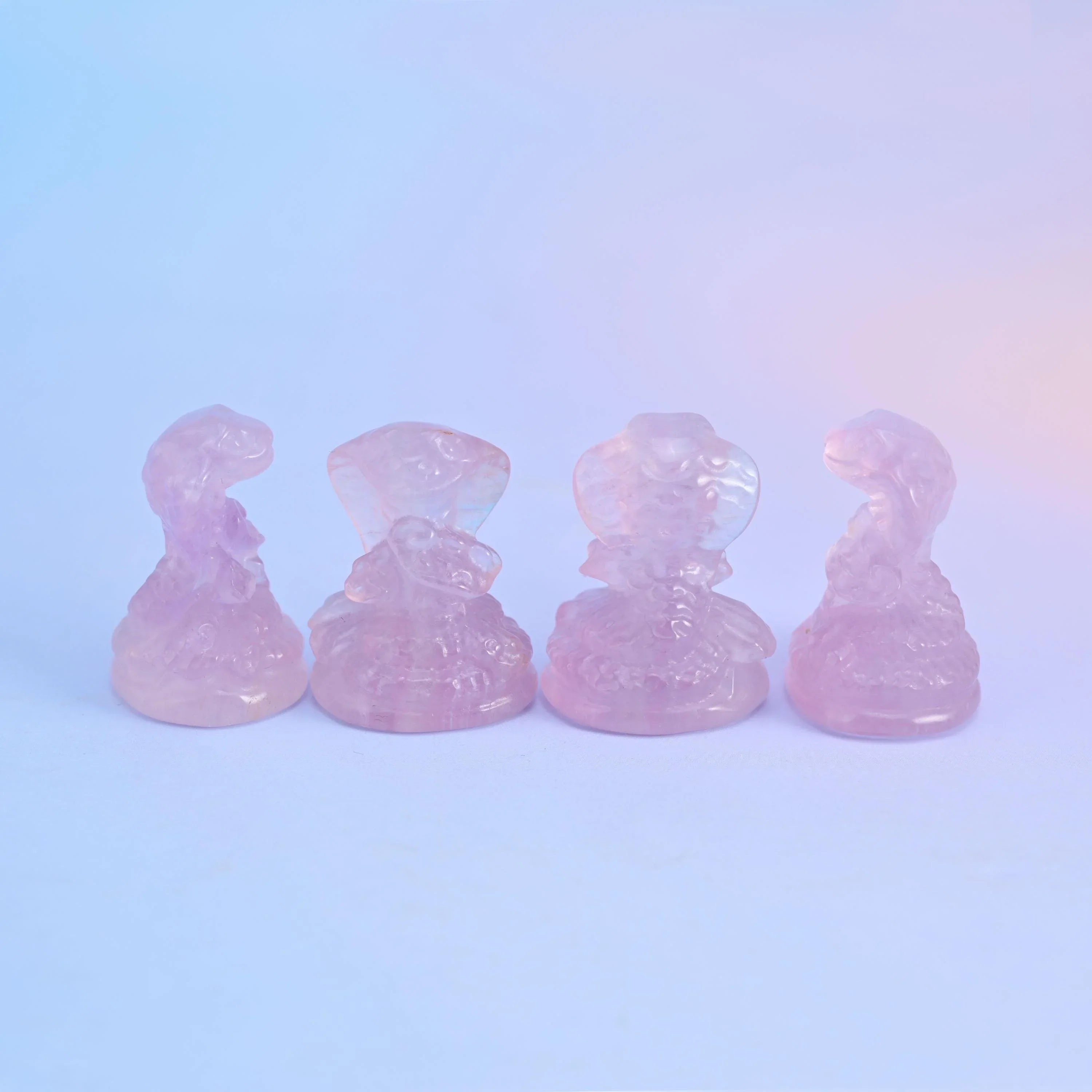 Hand-carved fluorite cobra snake, polished semi-transparent finish.