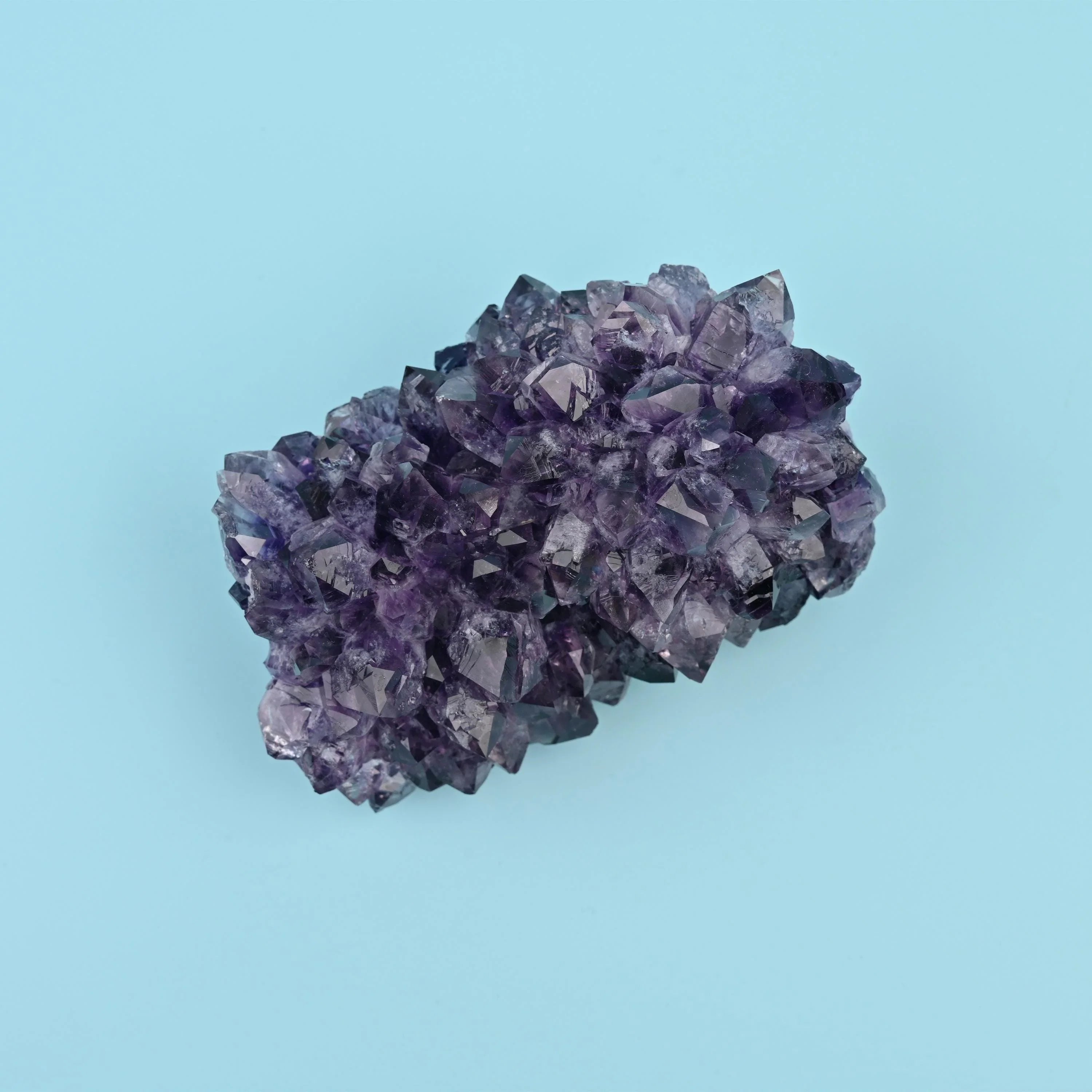 Amethyst Cluster with pale host rock attached along one edge.