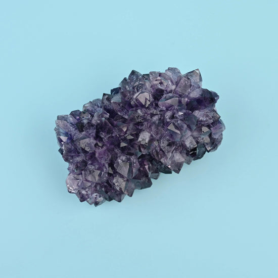 Amethyst Cluster with pale host rock attached along one edge.