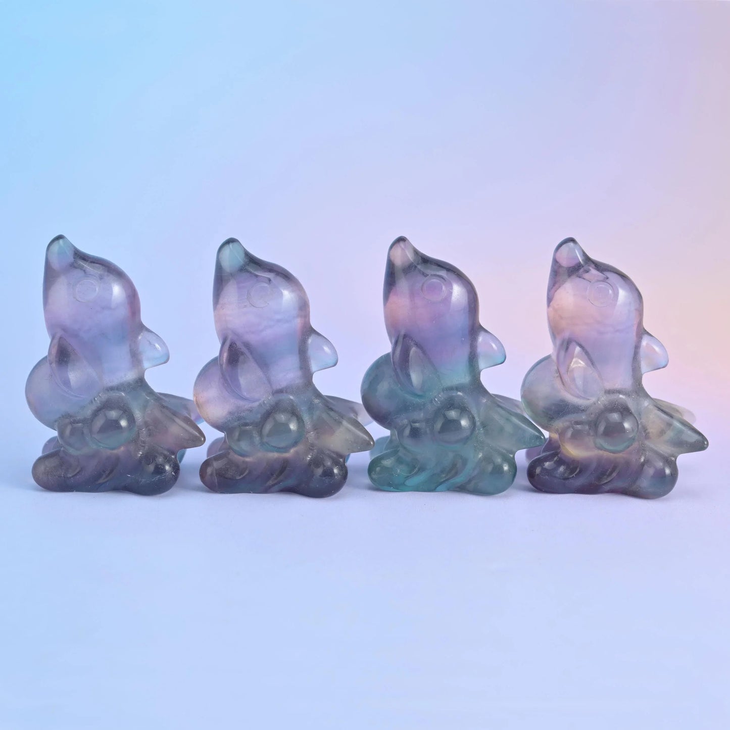 Fluorite dolphin carving in banded lilac, yellow, sea green and blue