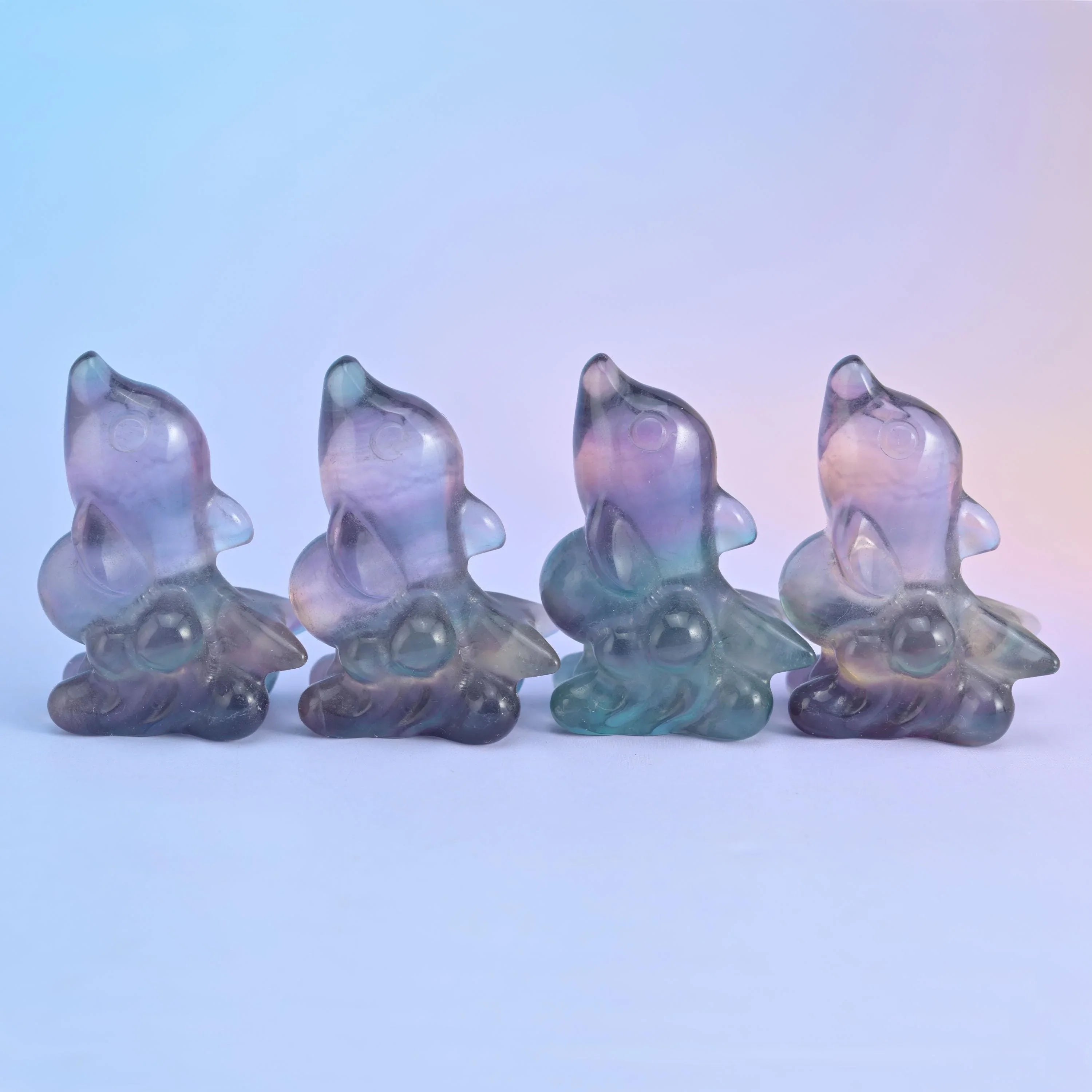 Fluorite dolphin carving in banded lilac, yellow, sea green and blue