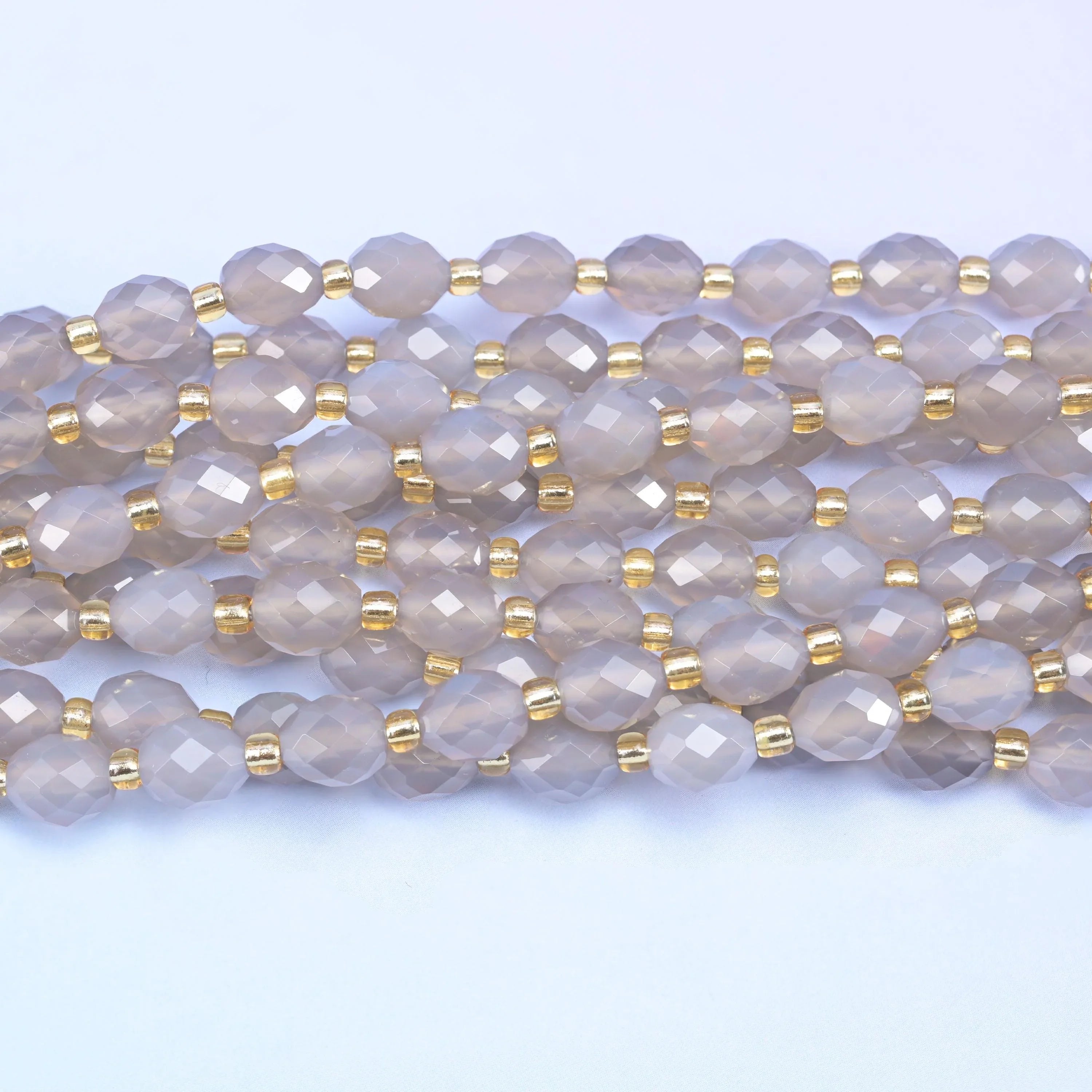 Faceted rice barrel cut gray agate beads