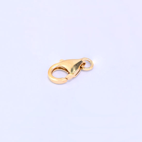 14K gold filled lobster clasp, 6x10mm, diagonal view showing the hinge from underneath, jump ring at the right