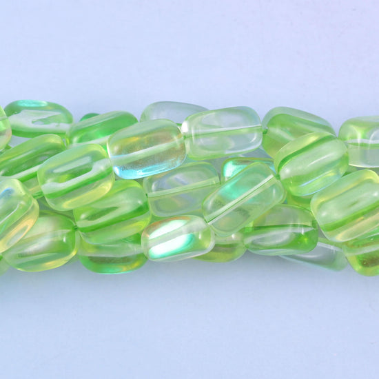 Rectangular cut glass beads with a glossy transparent finish and iridescent mystic aura coating