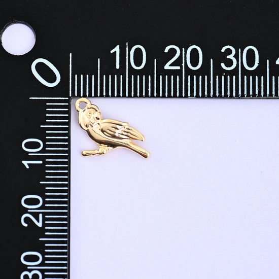 Small gold charms bird on a millimeter ruler showing the 9.1mm height, 18K gold plated