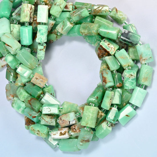 Australian jade faceted tube beads coiled into overlapping loops, whole strands of mint green and brown stone