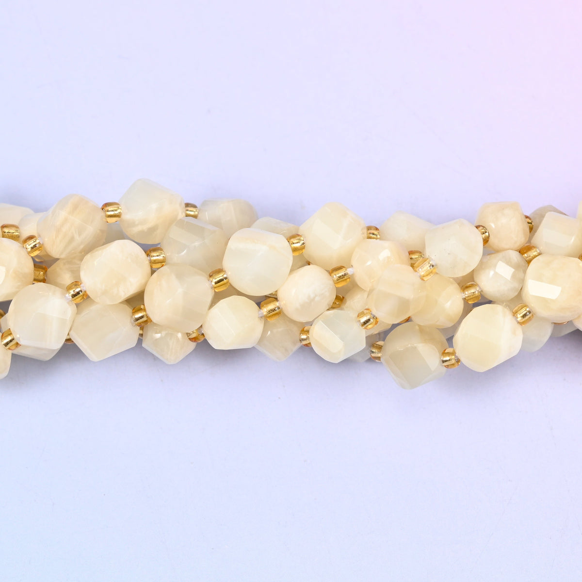 White Moonstone Faceted Spiral Twist Beads, creamy ivory and pale champagne stone with a soft inner glow