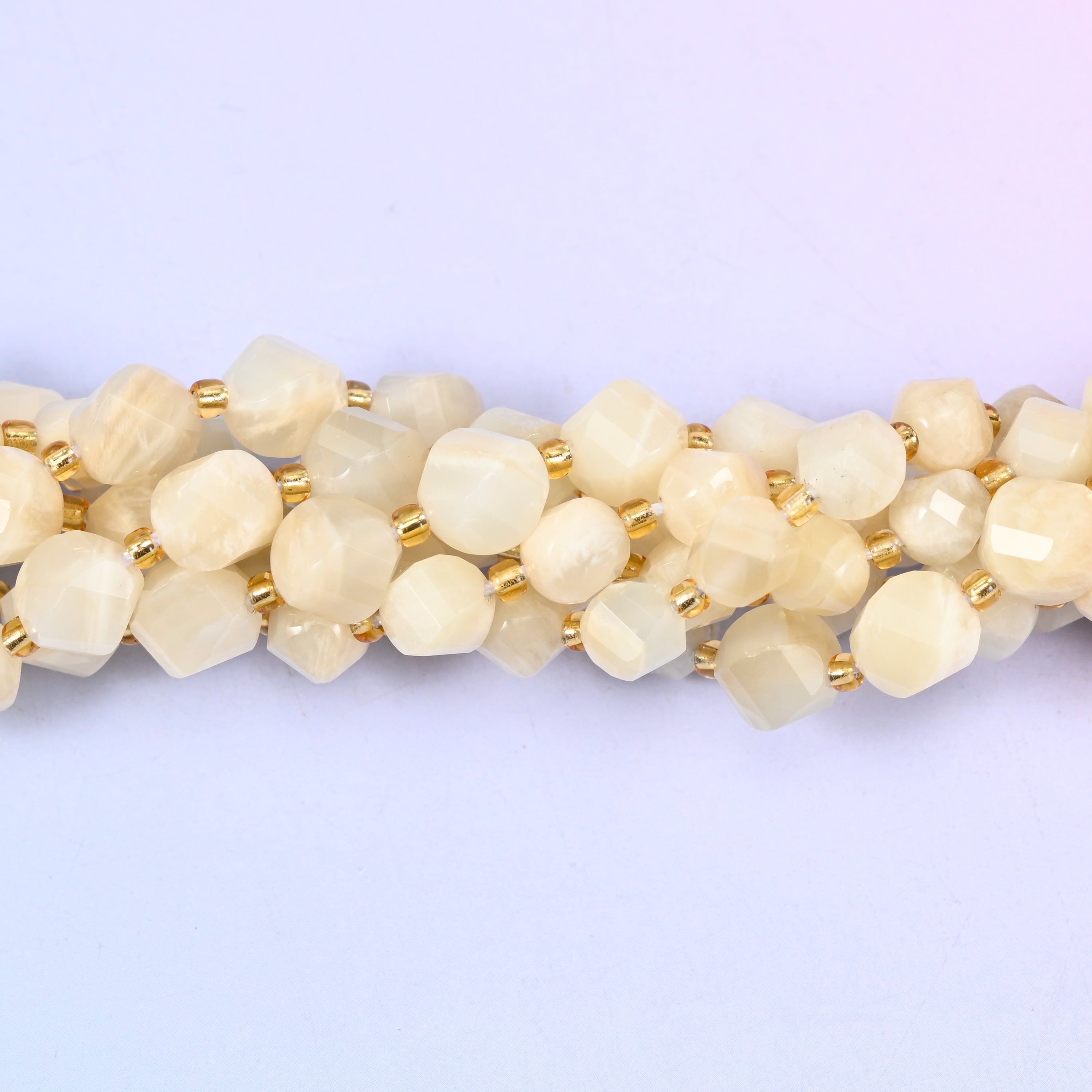 White Moonstone Faceted Spiral Twist Beads, creamy ivory and pale champagne stone with a soft inner glow