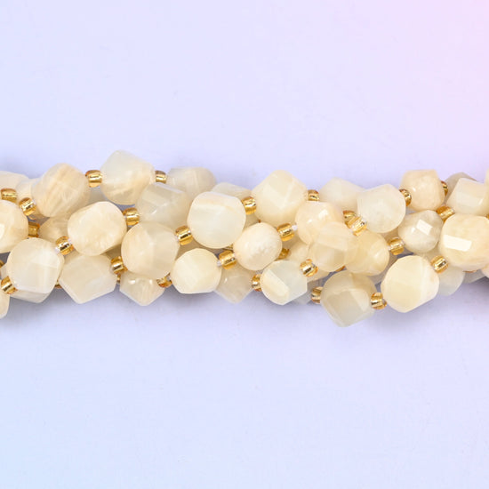 White Moonstone Faceted Spiral Twist Beads, creamy ivory and pale champagne stone with a soft inner glow