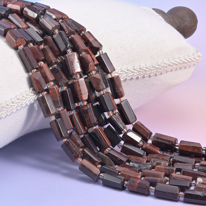 Natural Red Tiger Eye faceted tube beads with striking red and gold chatoyant shimmer.
