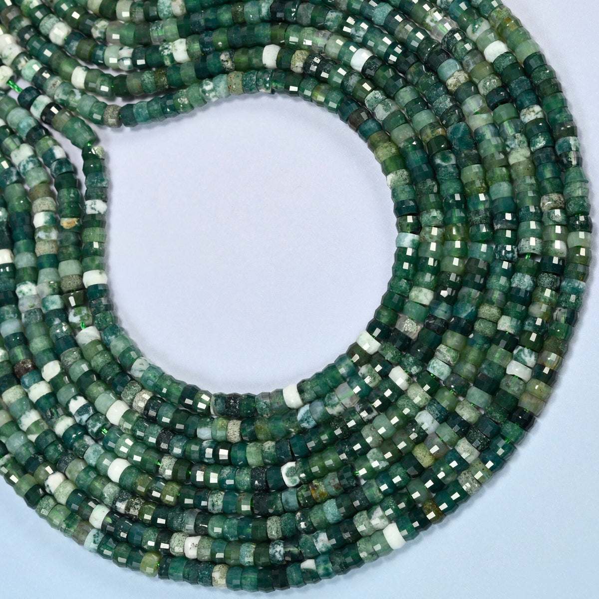 Moss agate faceted heishi disc beads curved into an open loop, forest green, gray-green and white beads