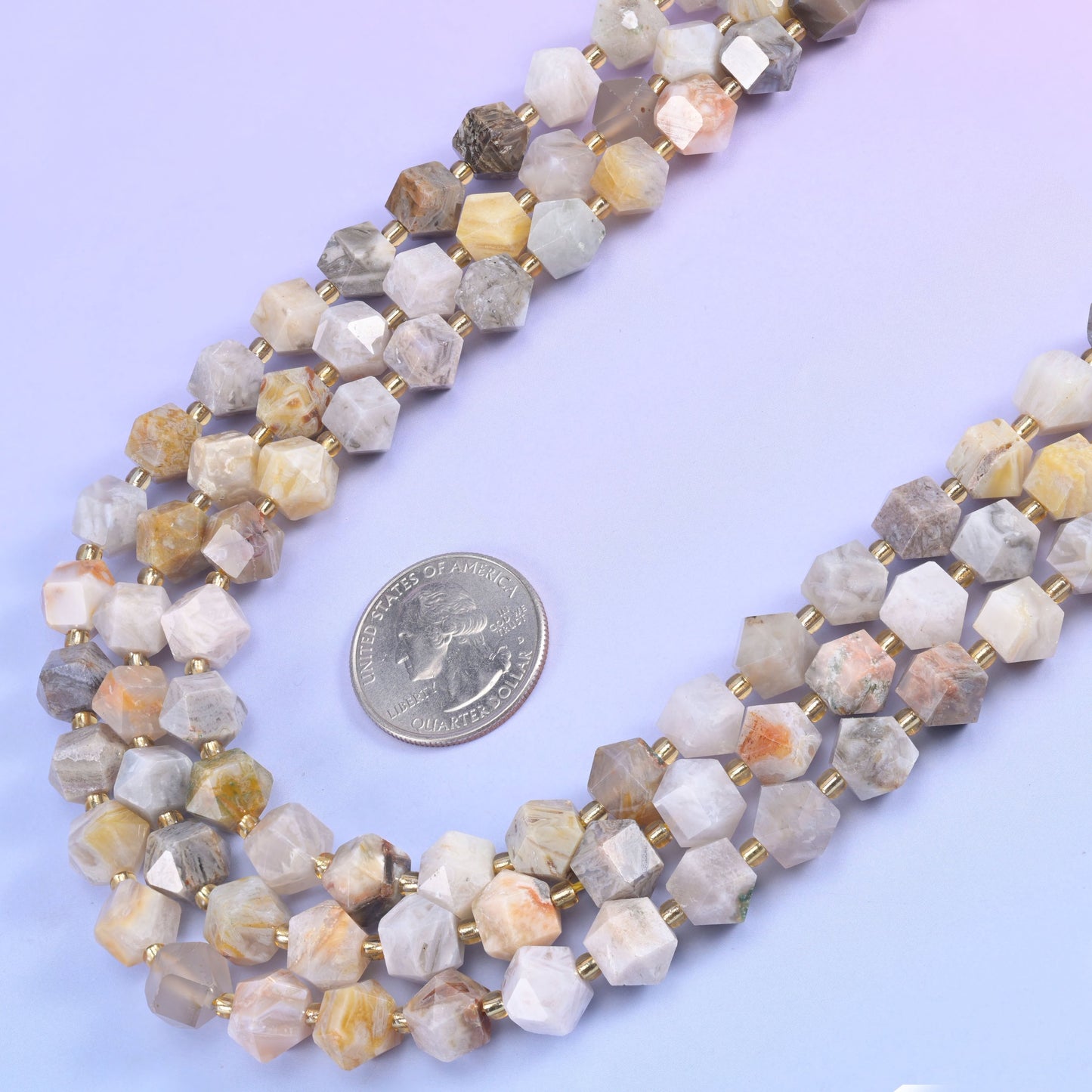 Eight-sided diamond rhombus cut beads that throw light back from several directions at once.