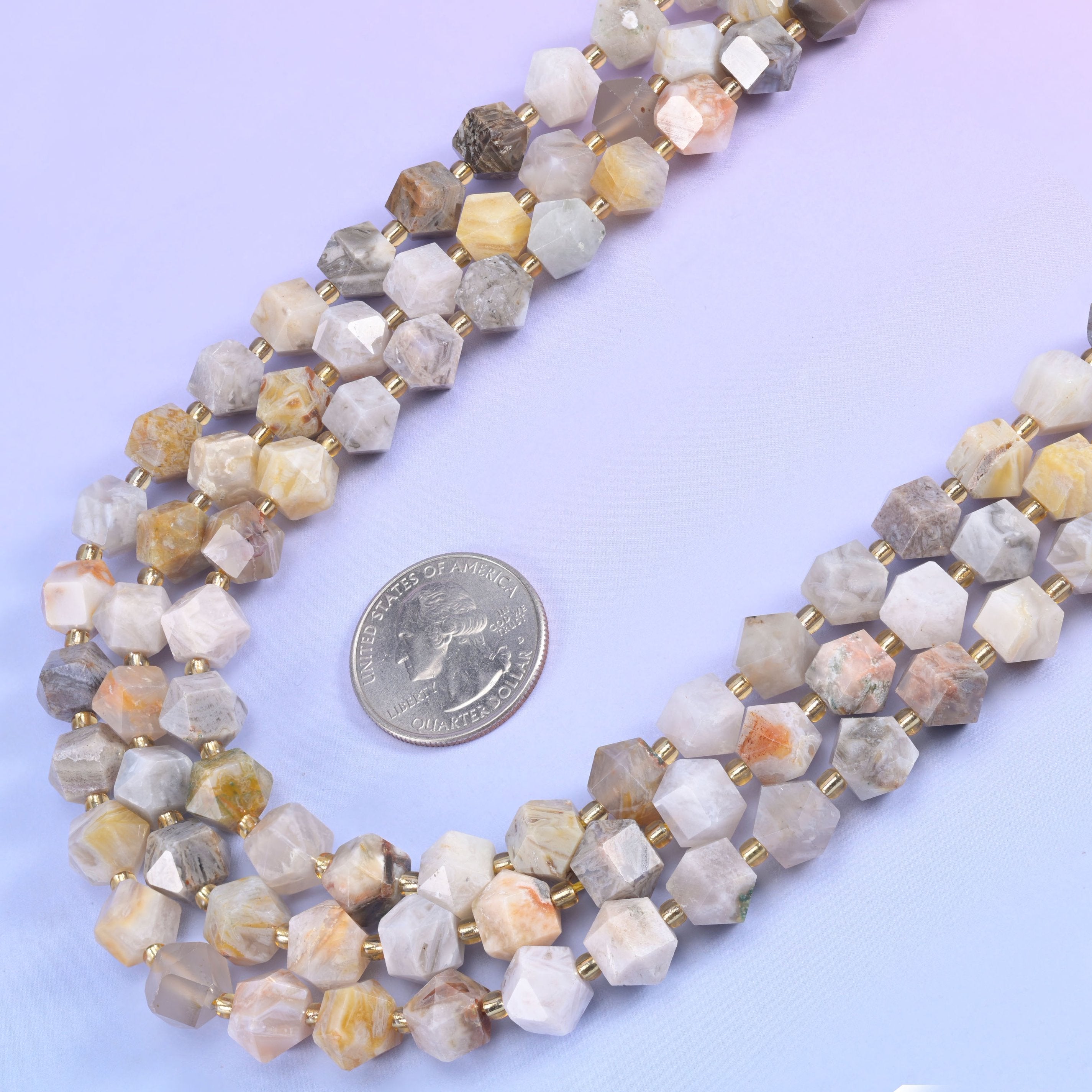 Eight-sided diamond rhombus cut beads that throw light back from several directions at once.