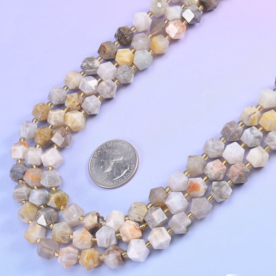 Eight-sided diamond rhombus cut beads that throw light back from several directions at once.