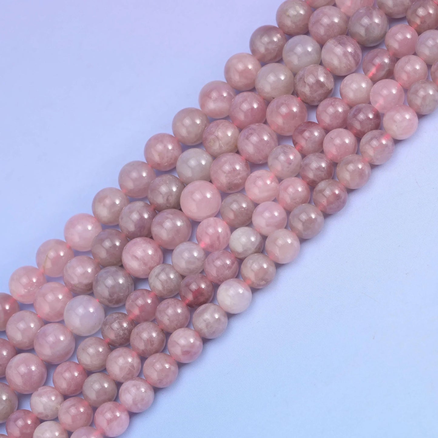 Madagascar Rose Quartz in dusty rose, mauve and grey-lavender.