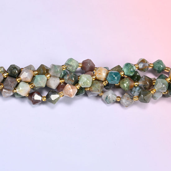 Indian Agate faceted bicone beads 8mm with gold-tone spacers, close-up of the strand laid straight