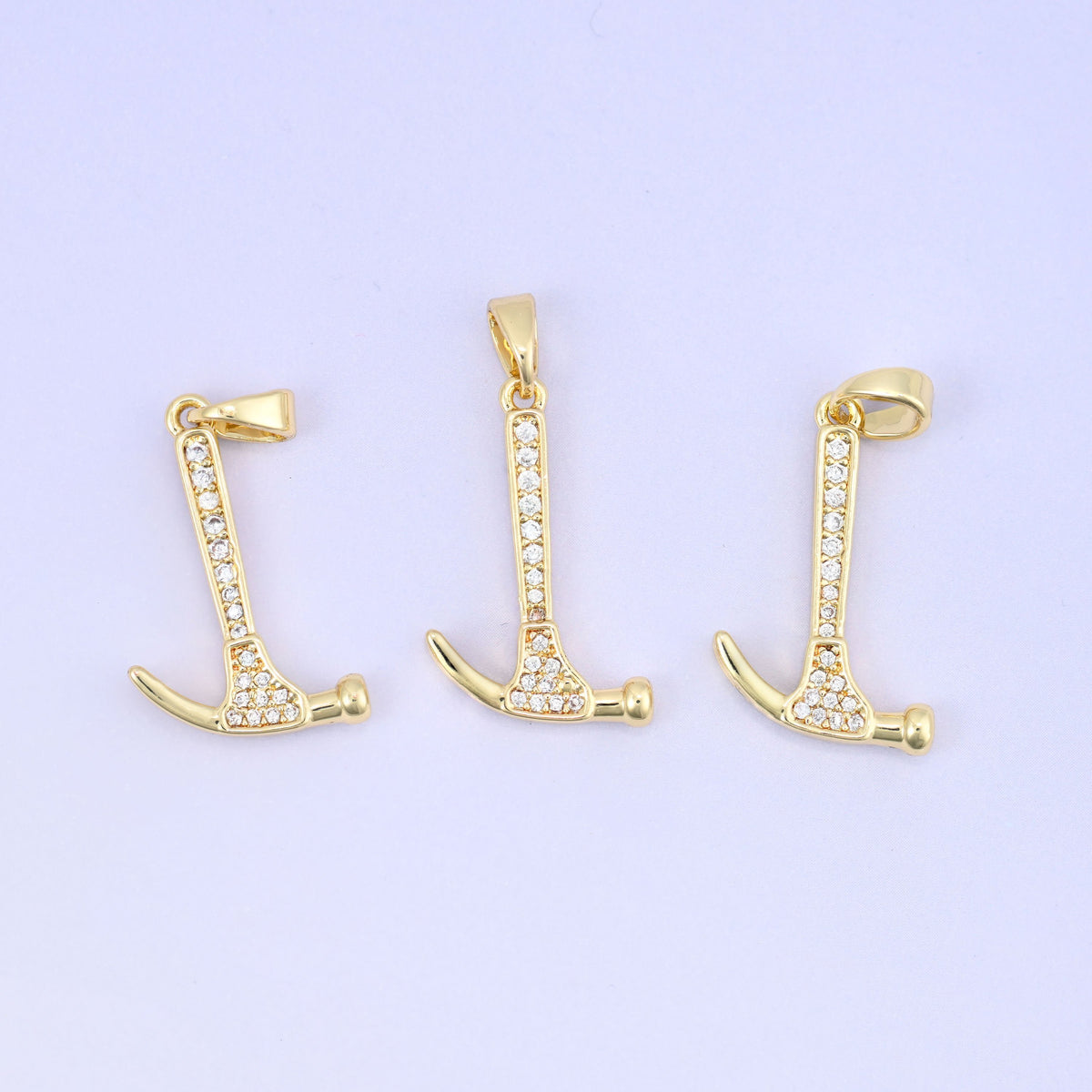 Brass hammer charm with sleek zirconia accent