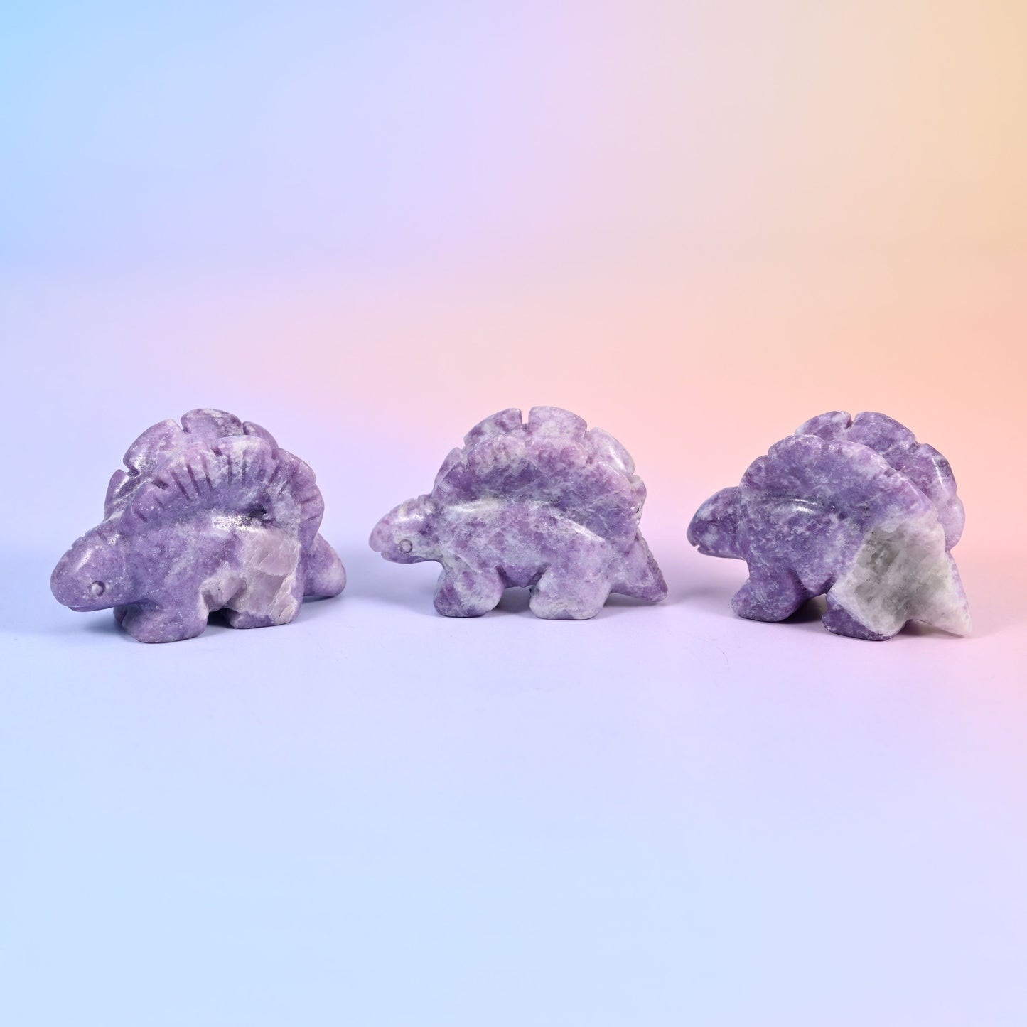 Carved stone stegosaurus figurine, polished to a high shine, about 1.4 oz, sold per piece