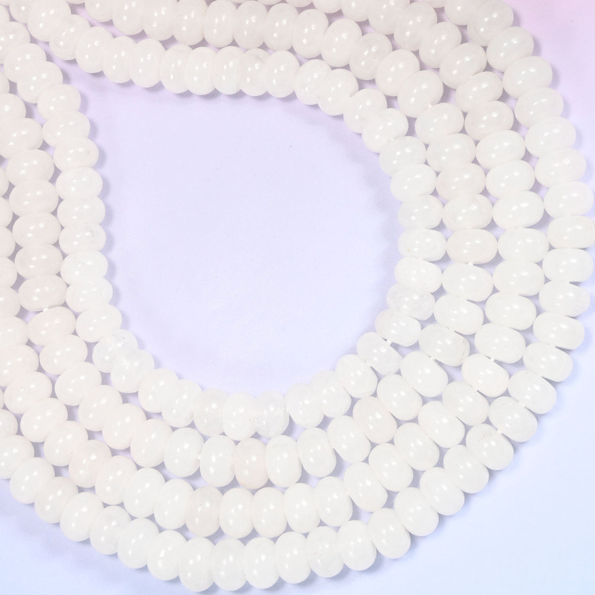 Natural White Jade Rondelle Beads with a large 2.5mm centrally drilled hole.