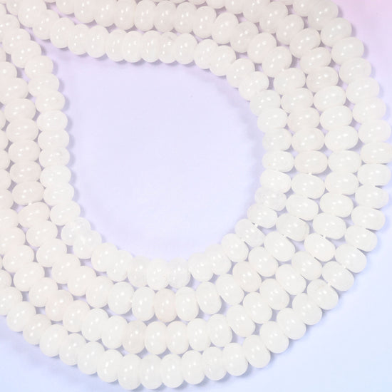 Natural White Jade Rondelle Beads with a large 2.5mm centrally drilled hole.