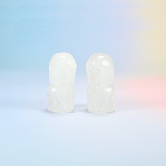 Two natural clear quartz hooded skull carvings, milky white with see-through edges