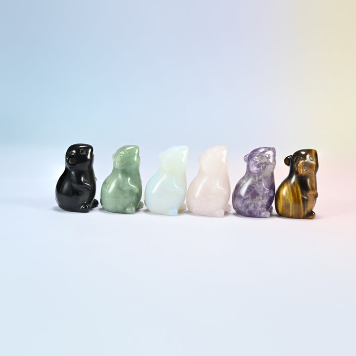 Side view of six gemstone mouse figurines sitting up on their back legs