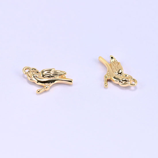 Small gold charms bird, two charms angled to show the feather detail on both sides