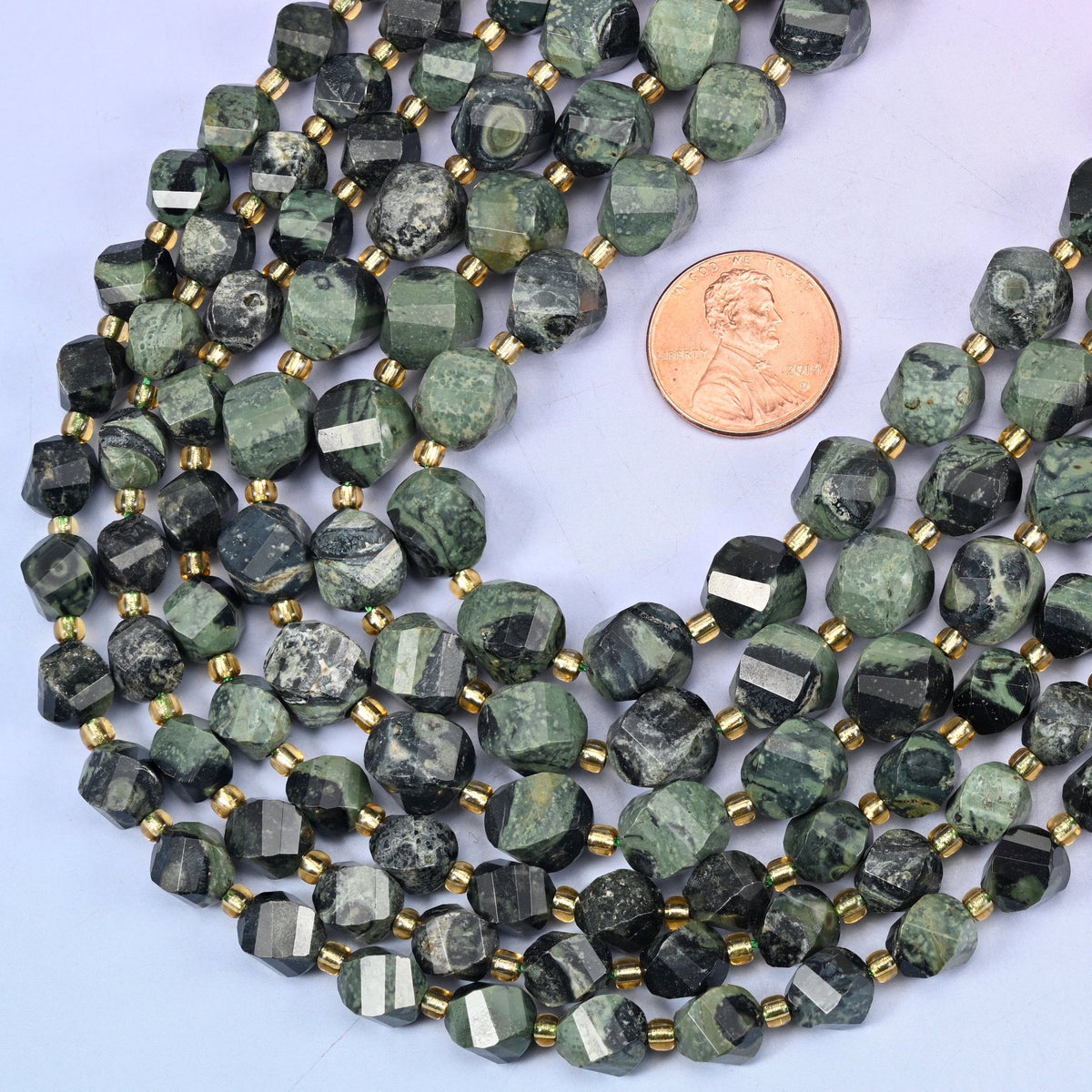 Faceted spiral twist cut Kambaba Jasper beads