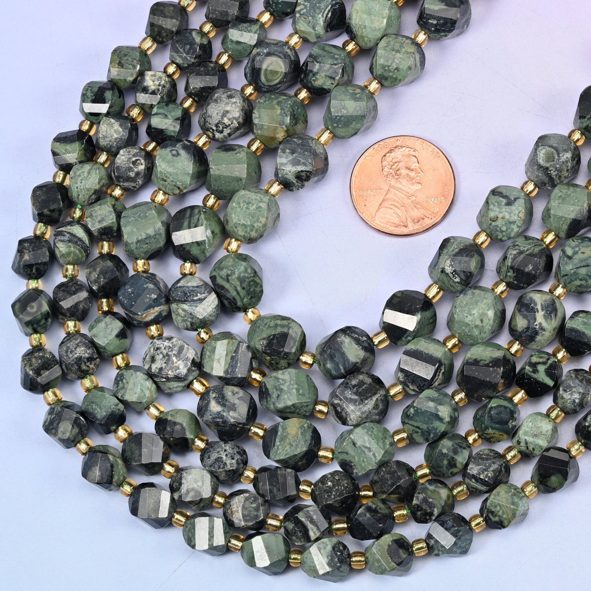 Faceted spiral twist cut Kambaba Jasper beads