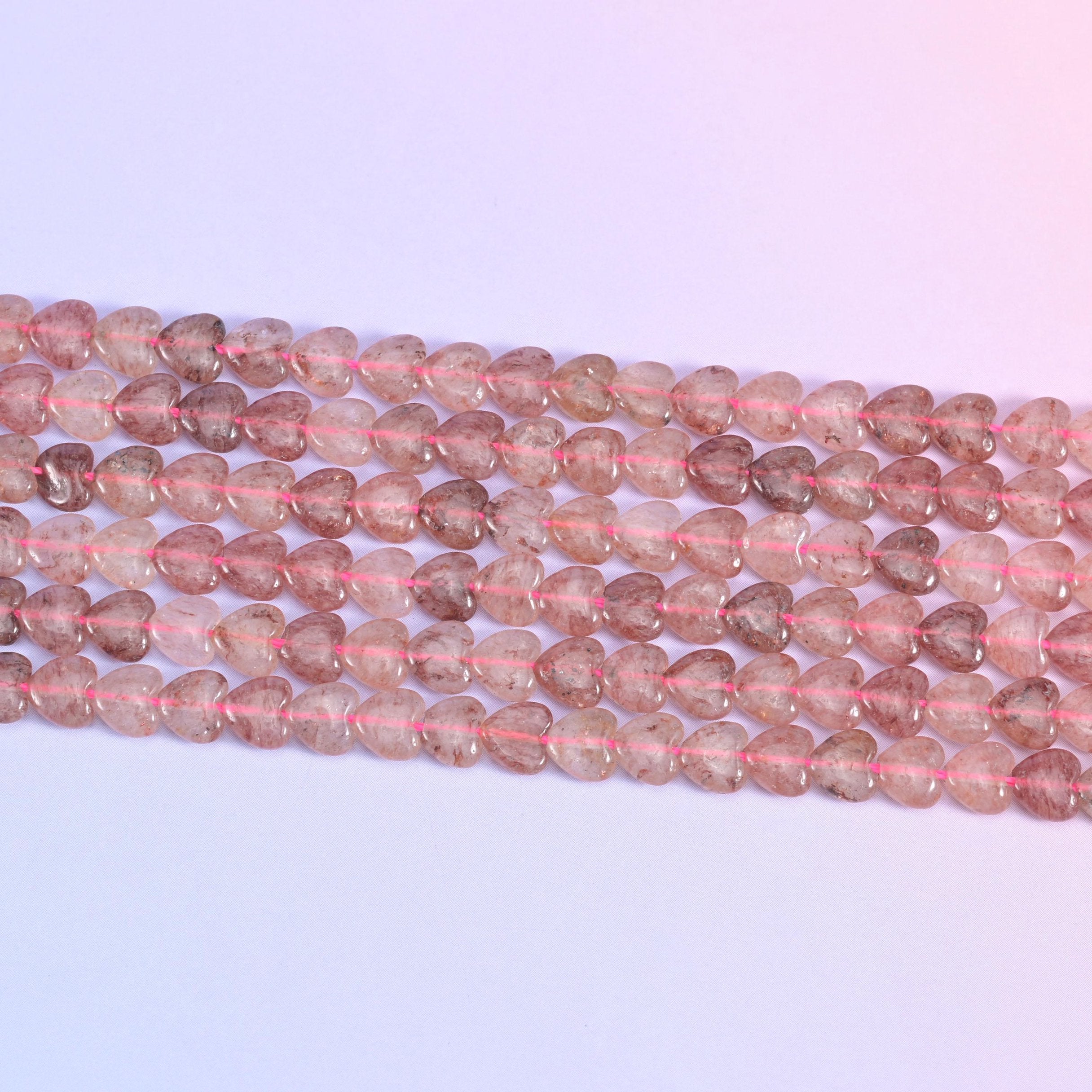 Strawberry Quartz Heart Beads in dusty rose with rust-red inclusions