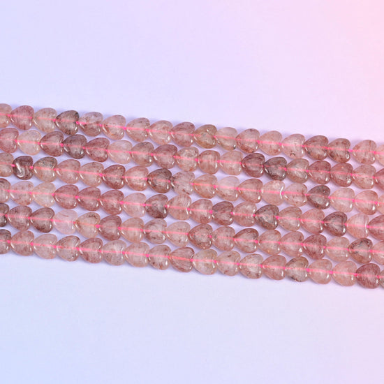 Strawberry Quartz Heart Beads in dusty rose with rust-red inclusions