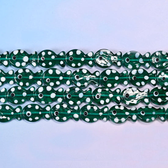 Fish glass beads in transparent deep bottle-green with white dots